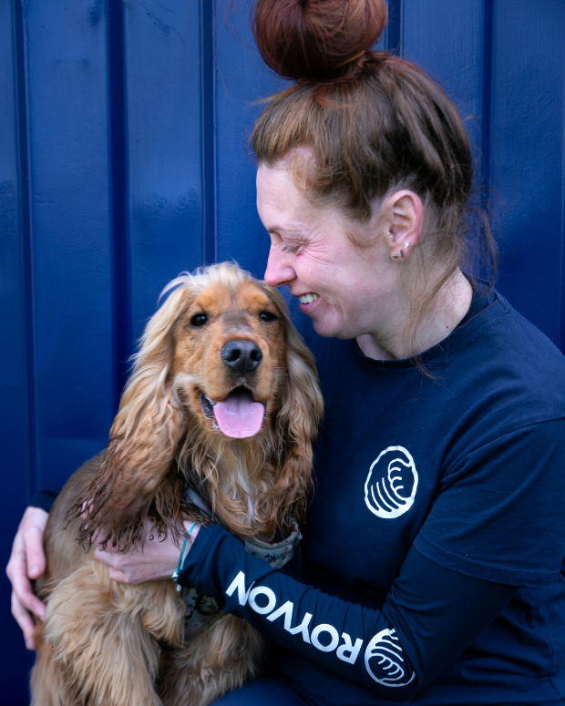 woman sitting with a happy dog