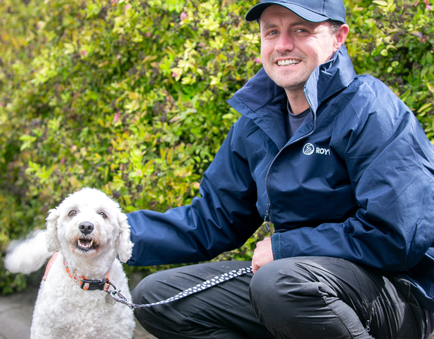 Richard smiling with a dog